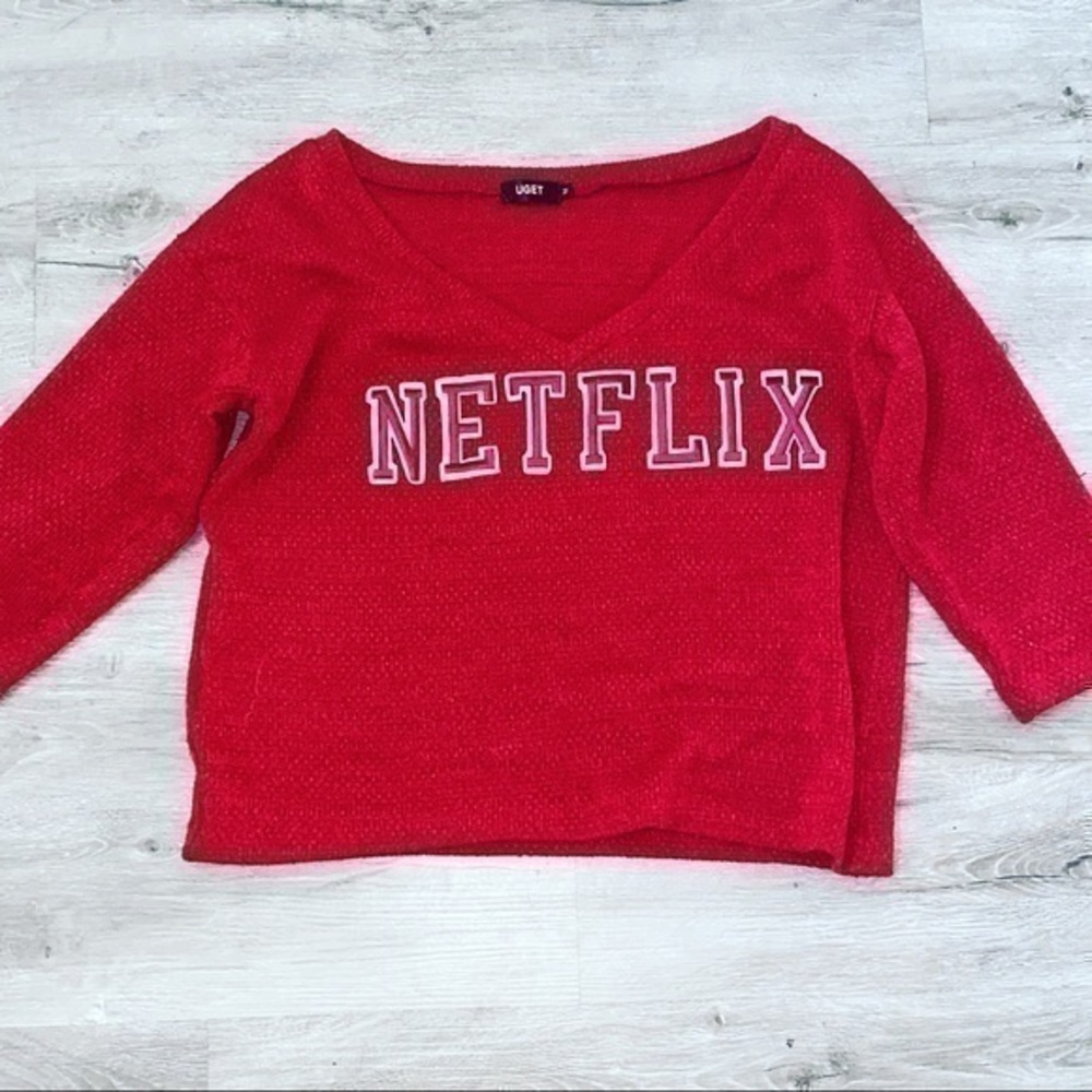 NETFLIX red long sleeve cozy boxy sweater.